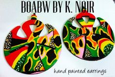 Hand painted with acrylic paints on med-weight wood.. Glossed with a clear gloss for protection.. 4.5in long Artistic Black Jewelry For Festival, Black Earrings With Artistic Design For Gift, Black Earrings With Artistic Design As A Gift, Unique Handmade Black Plug Earrings, Rasta Earrings, Afrocentric Earrings, Sterling Silver Cleaner, Hand Painted Earrings, African Earrings