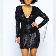 This Best Seller Black Pearl Beaded Dress Is A True Knockout This Deep V-Line Neck Plunges Into A Sea Of Beaded Sequins, Pearls And A Hint Of Metal Fringe. The Metallic Threads Are Black Tones But May Easily Be Paired With Gunmetal Or Antique Jewelry Sequins Dress Small Medium Large Pearl Dress Deep V-Neck Plunging Metal Fringe On Sleeves Mini Dress Stretch Lining Long Sleeves Back Zipper 48%Polyester 40%Pet 12%Spandex Fully Embellished Black Pearl Metallic Chain Long Sleeve Stunning Formal V Ne Embellished V-neck Bodycon Party Dress, Black V-neck Mini Dress With Contrast Sequin, V-neck Party Dress With Beaded Fringe, Embellished V-neck Sequin Dress For Date Night, Glamorous Beaded Fringe Dress For Date Night, Embellished V-neck Bodycon Dress For Night Out, Mini Length Beaded Fringe Dress For Party Season, Black Bodycon Dress With Contrast Sequin For Party, Embellished Mini Bodycon Dress For Holidays