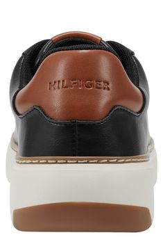 Debossed logos add signature appeal to a low-profile sneaker grounded by a cushioned footbed and classic cupsole. Lace-up style Memory foam cushioning Synthetic upper, lining and sole Imported High-top Leather Sneakers With Padded Tongue, Tommy Hilfiger Leather Sneakers For Streetwear, Tommy Hilfiger Sporty Sneakers With Embossed Logo, Sporty Tommy Hilfiger Sneakers With Embossed Logo, Classic Tommy Hilfiger Leather Sneakers, Tommy Hilfiger Low-top Sneakers With Embossed Logo, Tommy Hilfiger High-top Leather Sneakers, Tommy Hilfiger Leather High-top Sneakers, Tommy Hilfiger Sneakers With Rubber Sole