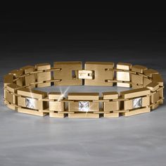 Every link is formed from premium stainless steel, finished in luxurious yellow gold. A true engineering breakthrough as steel is tough and hard-wearing, but our artisans have taken time and planning to design a style that suits this metal perfectly. Featuring 5 princess cut Diamondeau®, flawless simulated diamond. A classic bracelet should be part of every man’s wardrobe. Elegant Gold Bracelet With Rectangular Links In Stainless Steel, Timeless Stainless Steel Jewelry With Solid Link Construction, Timeless Stainless Steel Jewelry With Rectangular Links, Modern Gold Bracelet With Diamond, Polished Finish, Modern Gold Diamond Bracelet With Polished Finish, Modern Stainless Steel Jewelry With Rectangular Links, Modern Gold Stainless Steel Bracelet For Formal Occasions, Modern Stainless Steel Gold Bracelet For Formal Occasions, Modern Rectangular Gold Bracelet With Polished Finish