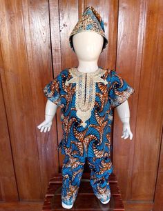 Beautiful African Wax Print boy's Set with special embroidery for casual or special occasion. The listing includes hat, top, and pants. There are three fabric designs to choose from.  Features: Embroidered Top Short Sleeves Comfortable Elasticated pants Embroidered Cap Please indicate the head circumference measurement for a perfect fit Care Instructions: Hand or machine wash with mild detergent on gentle cycle Hang to dry and iron as needed Fitted Blue Embroidered Pant Set, Casual Embroidered Short Sleeve Set, Traditional Blue Short Sleeve Set, Casual Embroidered Fitted Sets, Casual Fitted Embroidered Set, Casual Fitted Sets With Embroidery, Blue Fitted Cotton Pant Set, African Dashiki, Embroidered Cap