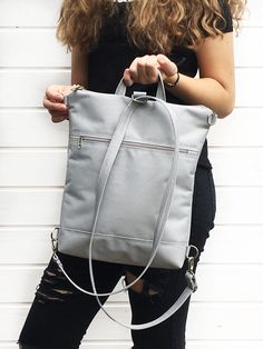 "Grey women backpack, Convertible Backpack, Gray Waterproof cross body bag, Vegan Rucksack, Travel backpack, Minimalist Backpack DETAILS - outer zippered pocket front and back - 4 inside open pockets - inside zipper pocket - zipper closure - metal parts nickel MATERIALS - outer: gray WATERPROOF CORDURA fabric - internal: gray - nickel metal hardwer - gray thread This bag is completely vegan. MEASUREMENTS --- EXTRA MINI backpack - crossbody Height of 9 inch = 23 cm width of the top 8 inch = 20 cm Slim Backpack, Unique Backpacks, Diy Leather Bag, Minimalist Backpack, Convertible Crossbody Bag, Minimalist Bag, Medium Backpack, Nickel Metal, Women Crossbody Bag