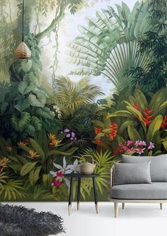 a living room with a couch, chair and wall mural