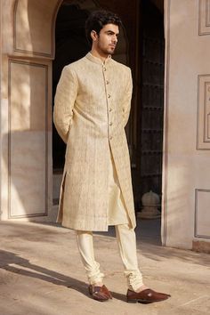 Beige champagne sherwani with badla embroidery. Comes with churidar and a kurta. - Aza Fashions Formal Beige Sherwani With Chikankari Embroidery, Formal Cream Sherwani With Straight Kurta, Formal Cream Sherwani Straight Kurta, Cream Bandhgala For Transitional Season, Elegant Designer Wear Beige Sherwani, Elegant Designer Beige Sherwani, Ceremonial Beige Kurta With Naqshi, Beige Naqshi Kurta For Ceremonial Occasions, Festive Ceremonial Cream Kurta