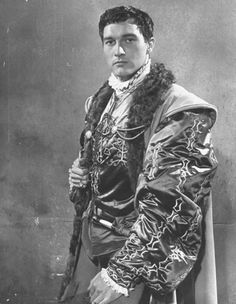 an old photo of a man dressed in costume