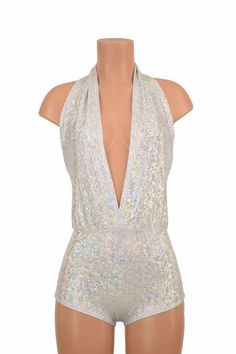 "This item is made to order, please read all the way through the listing before purchasing! This bodysuit is made of super sparkly silver on white shattered glass spandex! Deep V neckline and tie back halter top. Four way stretch for a figure forming fit. This bodysuit is unlined. Womens Sizing (See below for instructions on where measurements should be taken) XXS: Bust 29\"-30\" / Waist 22\"-23\" / Hips 30\"-32\" Extra Small: Bust 31\"-32\" / Waist 24\"-25\" / Hips 33\"-35\" Small: Bust 33\"-34 White Fitted Bodysuit For Party, White Backless Bodysuit For Party, Glamorous Shimmer Bodysuit For Party, Glamorous Party Bodysuit With Shimmer, Silver Fitted Bodysuit For Party, Fitted Silver Bodysuit For Party, Silver Shiny Stretch Bodysuit, White Sleeveless Party Bodysuit, White Sleeveless Bodysuit For Party