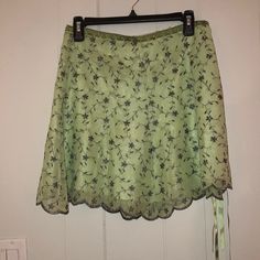 This Beautiful Sage Green Miniskirt Has A Bit Of A Preppy Vintage Vibe. Its Tulle Floral Design Sparkles With Little Rhinestones In Each Flower. It’s Fully Lined And The Tulle Lays Flat Against The Body. It’s Accented With An Adorable Pair Of Ribbons At The Side Waist Zipper. Green Floral Midi Skirt, Green Skirts, Mom Crafts, Skirt Ideas, Preppy Vintage, Moms Crafts, Floral Midi Skirt, Vintage Vibe, Green Skirt