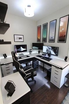 an office with multiple desks and pictures on the wall above them, along with two computer monitors