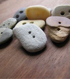 several different colored rocks with holes in them