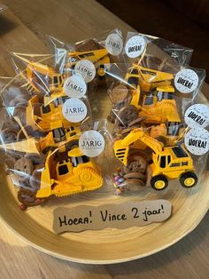 there is a cake made to look like a construction truck and some cookies on the plate