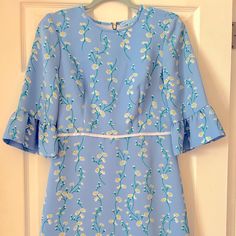 Light Blue Dress With Sunflower Vine Pattern. Bell Sleeves And Knee Length Hem. Never Worn, Has Tags! Fitted Blue Daisy Print Dress, Blue Fitted Floral Dress For Daywear, Fitted Blue Floral Dress For Daywear, Light Blue Floral Print Mini Dress For Daywear, Light Blue Floral Mini Dress For Daywear, Blue Floral Print Mini Dress For Daywear, Navy Knit Dress, Teal Blue Dress, Light Blue Dress