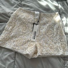 White And Ivory Sequined Shorts In Perfect Condition With Tags White Shorts For Summer Parties, Elegant Fitted Cream Shorts, White Party Shorts, White Fitted Party Shorts, Elegant White Party Shorts, Beige Fitted Shorts For Party, Beige Summer Party Shorts, Beige Fitted Party Shorts, Cream Fitted Shorts For Spring