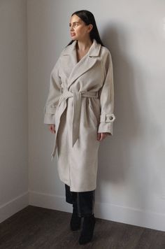 This belted wool blend coat is both stylish and luxe. Crafted from a wool blend in an oatmeal cream hue, it is fully lined for added warmth. Featuring an oversized collar, removable belt, and pockets, you'll stay cozy and chic in any weather. wrap style wide lapel collar buttoned tab on sleeve edge front welt pockets belted midi length lined hand wash self: 60% wool 40% polyester model is wearing a small Cozy Outfit Ideas Winter, Coat Outfit Winter, Curvy Date Night Outfit, Cozy Outfit Ideas, Cream Wool Coat, Air Clothes, Long Coat Outfit, Cream Coat, Oatmeal Cream