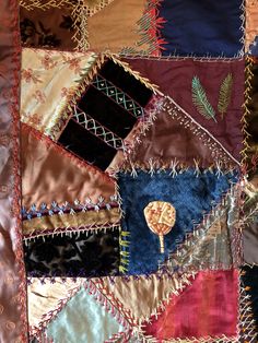 a patchwork quilt with different colors and designs