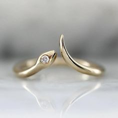 This open cuff snake ring is the epitome of cool girl chic as well as a stunning self care treat! Perfect to rock solo or snuggle a snake in a stackable ring. The smooth curves of the snake ring are crafted in 14k yellow gold and hold a glimmering white round brilliant cut diamond in the snake head.  The Details: Available in 925 Sterling Silver, 10K, 14K, 18K. .025 Carat White Round Brilliant Cut Diamond D E Color; VVS Clarity  Lab Grown Diamond Band Width is Approx. 1.50 mm Made to order in yo December Jewelry, Snake Ring Gold, Open Cuff Ring, Serpent Ring, Snake Ring Silver, Diamond Eyes, Rings Diamond, Snake Ring, Gold Snake