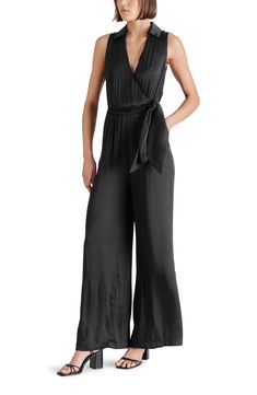 Comfort meets impeccable style in a breezy wide-leg jumpsuit cut from fluid, lustrous satin and shaped with a wrap-inspired waist tie. 60" length, 29" inseam, 24" leg opening (size medium) Hidden side-zip closure Surplice V-neck Sleeveless Side-seam pockets Unlined 100% polyester Machine wash, line dry Imported Chic Satin Jumpsuits And Rompers In Solid Color, Spring Evening Satin Jumpsuits And Rompers, Chic Solid Color Satin Jumpsuits And Rompers, Elegant Satin Jumpsuits And Rompers For Summer, Sleek Summer Jumpsuits And Rompers For Formal Occasions, Sleek Summer Formal Jumpsuits And Rompers, Sleek Formal Jumpsuits And Rompers For Summer, Chic Satin Jumpsuits And Rompers With V-neck, Elegant Satin Jumpsuit Or Romper In Solid Color