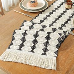 a table runner with black and white designs on it