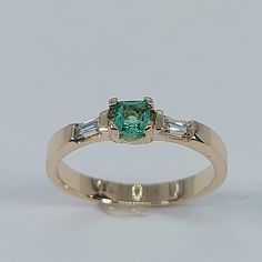 This stunning Emerald and Diamond Ring has been carefully crafted in warm 10K Yellow Gold , Authentic Emerald and Diamonds. Great for any occasion! Buy it for your-self or buy it for someone you love! Ring Weight and Stones Measurements: Ring weights 2.5 grams. Material: 10K Yellow Gold, Emerald and Diamonds Emerald Measurements:  3.5 mm  (Color:Green) Diamonds: 2 Diamond Baguette: 3.0 mm x 1.5 mm each , 0.06 ct Total Weight: 0.12 ct Ring Size: 7 1/2  All of my jewelry is handmade from scratch a Diamond Ring Women, Gold Emerald Ring, Green Diamonds, Smaragd Ring, Emerald Rings, Diamond Baguette, Emerald Ring Gold, Ringe Gold, Rings Diamond