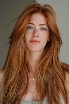 Portrait of a woman with long, wavy red hair and freckles, looking directly at the camera. Long Hair Heart Shaped Face, Heart Face Shape Hairstyles, Chin Length Haircuts, Chic Haircut, Short Bobs