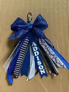 a key chain with ribbons attached to it