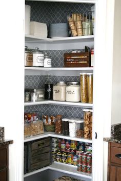 an organized pantry with lots of food in it