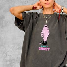 Embrace the spooky season with our "I'm Just a Ghost" T-Shirt, a cute and stylish addition to any Halloween wardrobe. Crafted from premium Comfort Colors fabric, this tee offers unmatched comfort and quality, making it the perfect Halloween gift for her! Why You'll Love This T-Shirt 🌟: 👻 Adorable Halloween Design: Features the sweet and simple phrase "I'm Just a Ghost" that adds a touch of fun and whimsy to your Halloween celebrations. 🌿 Sustainably Made: Crafted with 100% ethically sourced U Halloween Novelty T-shirt For Streetwear, Novelty Halloween T-shirt For Streetwear, Halloween Novelty Streetwear Top, Funny Halloween T-shirt For Streetwear, Funny Halloween Streetwear T-shirt, Spooky Halloween T-shirt For Streetwear, Halloween Grunge T-shirt With Character Print, Grunge T-shirt With Character Print For Halloween, Spooky Funny Print T-shirt For Streetwear