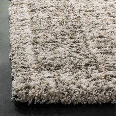 an area rug is shown with black and white carpet on the floor in front of it