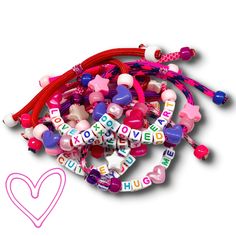 a bunch of bracelets with words and hearts attached to each other on a white background