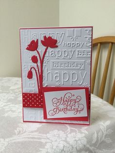 a happy birthday card sitting on top of a table