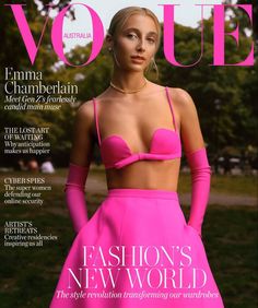 a woman in a pink dress on the cover of a magazine with her hands on her hips