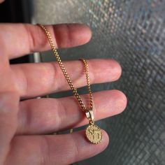 This is a gold or rhodium plated Chai Life Symbol pendant. It's made of solid brass and cast from a vintage mould at a production house in Rhode Island and then I hand polish and gold plate it in Toronto, Canada.  You can buy it with or without the chain and I can make the chain any length you want up to 23.5". Chain has a long lasting gold or rhodium plating and has a lobster clasp.  Rhodium is a silver tone precious metal, when you think of white gold you're thinking of rhodium. Message me if Gold Engraved Round Pendant Chain Necklace, Gold Engraved Round Pendant Necklace, Gold Stainless Steel Round Pendant Necklace, Gold Pendant Charm Necklace With Box Chain, Gold Charm Necklaces With Box Chain, Gold Engraved Charm Necklace In Stainless Steel, Gold Charm Necklace With Box Chain As Gift, Gold Charm Necklaces With Box Chain For Gifts, Gold Charm Necklace With Box Chain For Gifts