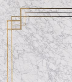 an art deco marble background with gold lines and rectangles in the middle on top of it