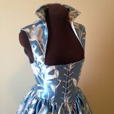 This is gown is newly made and will be the prettiest gown at this seasons' festivals and events!! The original fabric is out of stock however, the 2nd photo is a gorgeous blue damask which your gown will be made from. The bodice is fully lined and interlined, and steel-boned along the front closure of 14 silver grommets, and additional poly boning along the front seams for added support. The gathered overskirt is firmly attached to the bodice and is split down center front, shown over a hoop-sli Gown Dress, Women's Costumes, Playing Dress Up, Pale Blue, Damask, Dress Making, Gowns Dresses, Sewing Projects, Bodice