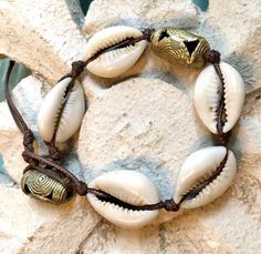 Love these #Cowrie #Shells on this #Bracelet! #TheBeadChest #EthicallySourced #Jewelry #Chic #AfricanBeads #StoneBeads #Turquoise #DIY #Boho #JewelryBlogger #EtsyShop #EtsyStore #BeadMaker #HealingStones #CrystalJewelry #HomeDecor #InteriorDesign #Designer #DIYDecor #Pottery #TurquoiseBeads #TurquoiseBead West African Art, Diy Boho, Cowrie Shells, Making Crafts, African Beads, Cowrie Shell, Turquoise Beads, African Art, Healing Stones