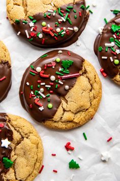 several cookies with chocolate frosting and sprinkles