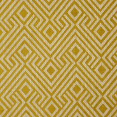 a yellow and white pattern on fabric