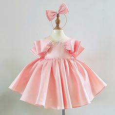 🎀 Welcome to MuslinblanketVN! We specialize in handcrafted children's dresses, offering a wide variety of styles, materials, and colors. Our attention to detail and quality craftsmanship are second to none. Every dress is made with care and can be customized to your specifications. Explore our collection and find the perfect dress for your little one! **Dress Details - Dress Length: Mid - Calf - Dress Color: Blush pink, White - Material:  Tulle, Lace Blush Pink Baby Girl Dress: This gorgeous bl Easter Birthday Dress With Ruffles, Easter Birthday Princess Dress With Ruffles, Pink Bow Dress For Birthday, Pink Princess Twirl Dress For Party, Pink Dress With Bow For Birthday, Cute Baptism Dresses For Easter, Cute Dresses For Baptism And Easter, Pink Easter Dress For First Birthday, Pink First Birthday Dress For Easter