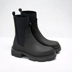 Crafted from genuine leather, these calf-length Chelsea boots are designed for both comfort and fashion. With an elastic band at the top, they offer a secure and snug fit while ensuring ease of wear. A comfortable and durable sole makes them perfect for all-day wear, while a stretchy upper provides comfort on the move and adds a contemporary twist to their classic design. Sleek black accents allow these boots to pair seamlessly with any outfit, be it casual or dressy. Ideal for those looking for Sock Ankle Boots, Black Footwear, Elegant Gift Wrapping, Womens Booties, Booties Ankle Boots, Leather Socks, Leather Chelsea Boots, Shoe Gifts, Black Accents