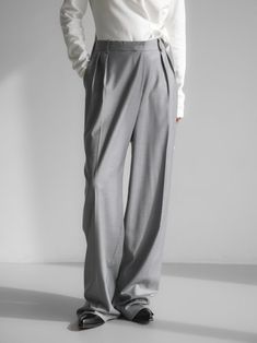 High rise trouser with wide leg and an unbalanced fly at waistband. Creates a stunning silhouette and interesting design. Model is in MINUSEY S. ✔️ Free worldwide express shipping over $100✔️ Loved by 6,500+ customers✔️ Limited edition collections, maximum style⠀⠀⠀⠀⠀⠀⠀⠀⠀Stay ahead of the trend with can’t-find-anywhere-else staples. Your closet will thank you 💕 * MINUSEY S = EU 34, US 2* MINUSEY M = EU 36, US 4* 10% Wool / 60% Polyester / 28% Rayon / 2% Spandex* Dry clean* Made in Korea - Model Height: 172cm/5'7" (US2, EU34) Elegant Gray Wide Leg Pants With Pockets, Elegant Gray Wide Leg Pants, Elegant Gray Full-length Wide Leg Pants, Avant-garde Baggy Wide Leg Bottoms, Avant-garde Baggy Wide Leg Pants, Gray Wide Leg Full Length Pants For Formal Occasions, Gray Formal Wide Leg Full Length Pants, Formal Gray Wide Leg Pants, Chic Gray Wide Leg Full Length Pants