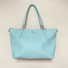 "m348 Vintage Coach Women's Crossgrain Luxury Ava Tote Handbag Light Blue PLEASE READ ENTIRE DESCRIPTION BEFORE PURCHASING Crossgrain Luxury Ava Tote Bag. Light Blue Color Leather, Light Blue lining. Inside zip, cell phone and multifunction pockets. Zip-top closure, fabric lining Handles with 9\" drop. Outside slip pocket 12 1/2\" (L) x 9 3/4\" (H) x 5\" (W) 3 large pockets inside, one zippered. Leather patch with #F1792-F11900. Private Estate Collection, one owner. Sold as is, as shown on pictu Bag Light, Tote Handbag, Light Blue Color, Vintage Coach, Leather Patches, Antique Items, Zip Top, Tote Handbags, 4 H