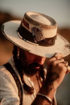 Cheap Fitted Hat Bands For Country Events, Artisan Leather Brimmed Hats, Artisan Leather Hat For Rodeo, Handmade Leather Hat With Flat Brim, Handmade Artisan Hat Bands For Outdoor, Artisan Handmade Leather Hat, Handmade Artisan Leather Hat, Leather Bohemian Hats For Festivals, Bohemian Leather Hat With Short Brim