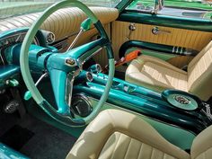 the interior of an old car is green and beige