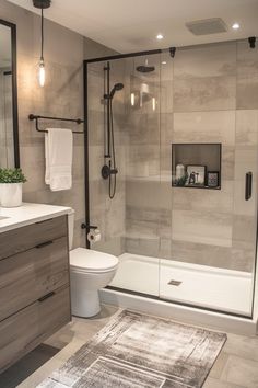 a bathroom with a shower, toilet and rug in the middle of the bathtub