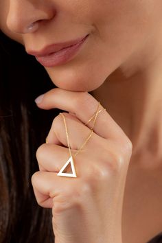 Dainty Gold Triangle Geometric Necklace, 14k 18k 10k Minimalist Gold Necklace, Christmas Gift for Her, Teacher Appreciation Gift Jewelry FEATURES * Solid Gold (real gold, not gold plated or gold filled material) * Gold Karat: 10K (417) - 14K (585) - 18K (750) (optional) * Pendant Height 0.62 Inches (1.58 cm) * Pendant Width 0.68 Inches (1.72 cm) Our gold necklaces are perfect choice for a Christmas, Mother's Day, valentine's day, birthday, wedding, anniversary, graduation, engagement, bridesmaid Minimalist Triangle Jewelry For Formal Occasions, Simple 14k Gold Necklaces, Elegant Triangle Jewelry For Gifts, Modern 14k Gold Filled Necklaces As Gift, Modern 14k Gold Filled Necklaces For Gifts, Modern 14k Gold Filled Necklace For Gift, Modern 14k Gold Filled Necklace As Gift, Gold Triangle Jewelry For Formal Occasions, Minimalist Triangle Jewelry For Anniversary