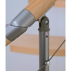 a close up of a metal pole with a wooden handle