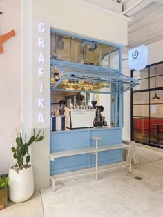 a blue and white display case in a building