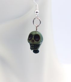 Resin skulls in green set on silver earrings.  Spooky scary Skeletons.... I love the song and most skeletons make me think of it.  These guys are perfect for Halloween. Green Halloween Dangle Earrings, Green Novelty Earrings For Halloween, Green Novelty Jewelry For Halloween, Spooky Scary, Skull Earrings, Skeleton, Silver Earrings, Jewelry Earrings Dangle, Etsy Earrings