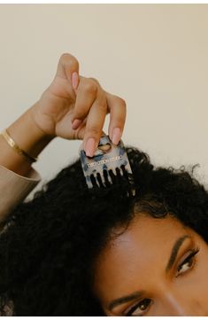 What it is: A compact wide-toothed comb for detangling, fluffing up your hair and so much more.Who it's for: Ideal for thick, wavy, curly and coiled hair types.What it does: The comb is designed to dig down to the scalp, allowing the hair roots to be stretched straight into a desired style or shape using a picking motion. Not only will this detangle textured hair with minimal tension and damage on the hair strand, it also helps lift from the root, creating big, voluminous hair. The comb was insp Curly Hair Salon, Hair Inspired, 3c Hair, Scrub Corpo, Hair Gloss, Hair Roots, Hair Coils, Wooden Comb, Glam Hair