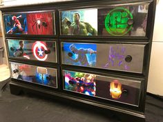 the avengers dresser is decorated with images of superheros