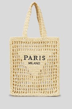 a beige bag with the words paris on it, and an image of a woman's face